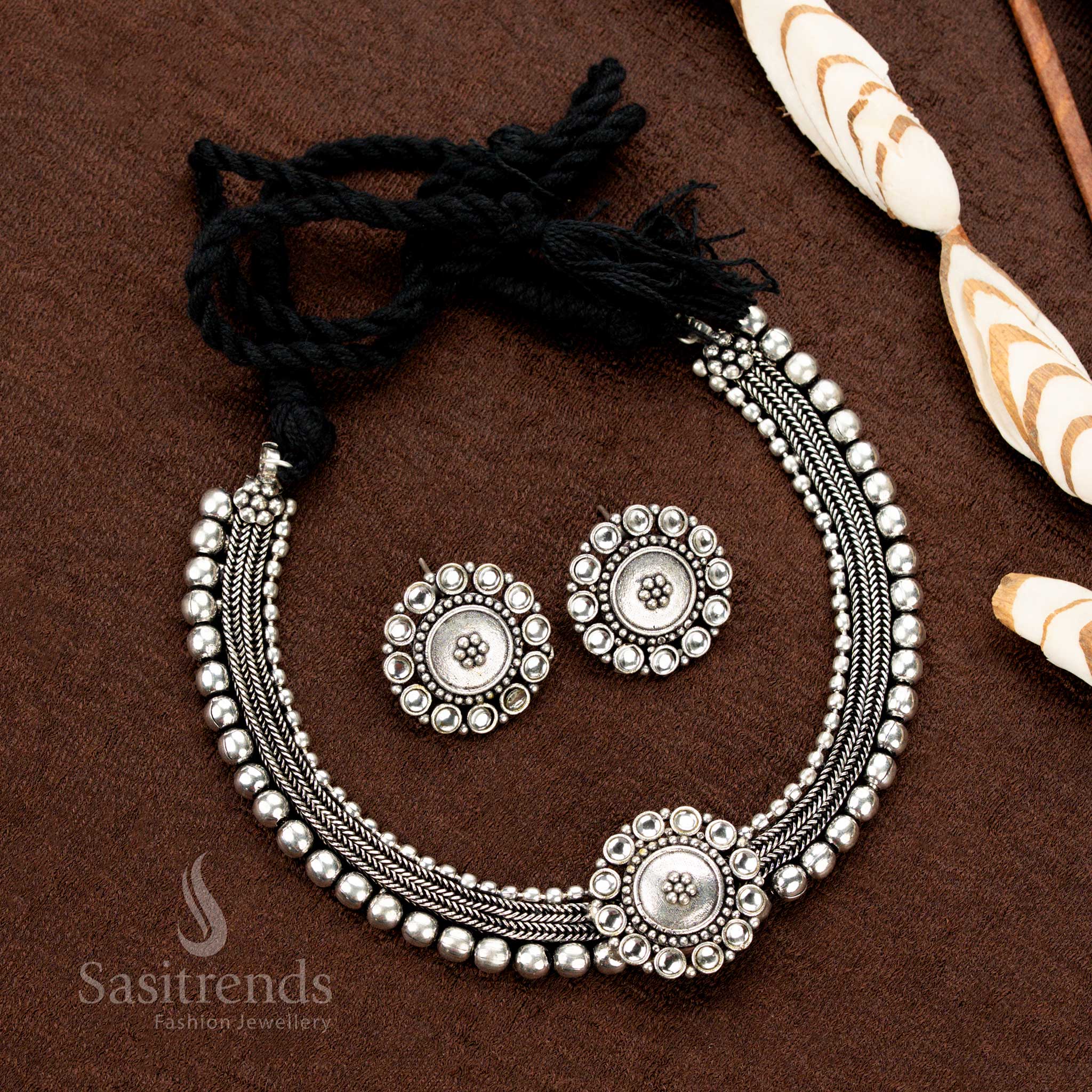 Kolapuri oxidised choker set with pearly white floral stones, vintage-inspired dual-tone silver finish, and traditional design — ideal for Navaratri, sarees, and ceremonial attire - Sasitrends