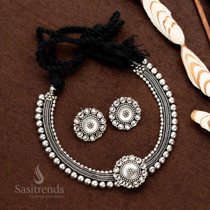 Kolapuri oxidised choker set with pearly white floral stones, vintage-inspired dual-tone silver finish, and traditional design — ideal for Navaratri, sarees, and ceremonial attire - Sasitrends