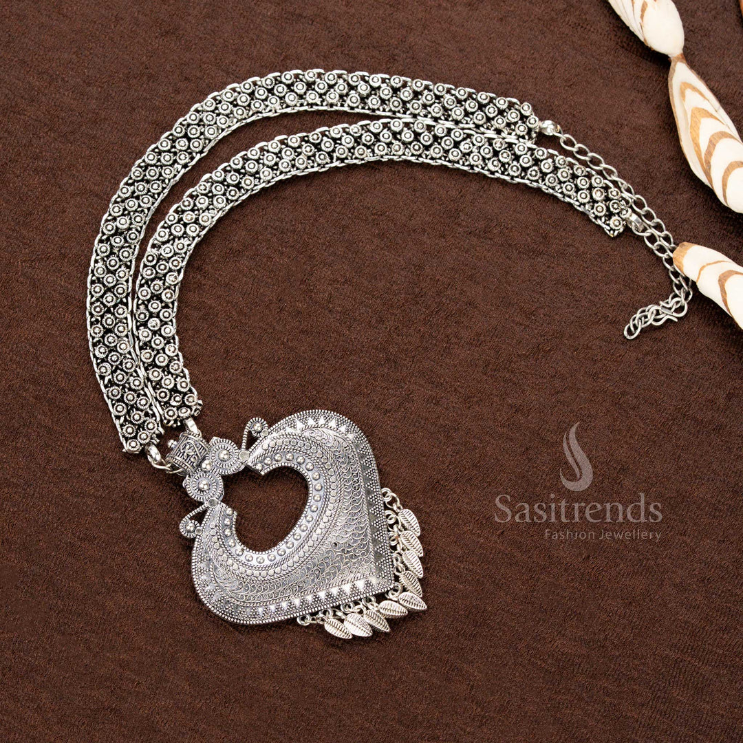 Oxidised tribal necklace with heart-shaped pendant, leaf danglers, and double floral chain – traditional Navaratri jewellery - Sasitrends