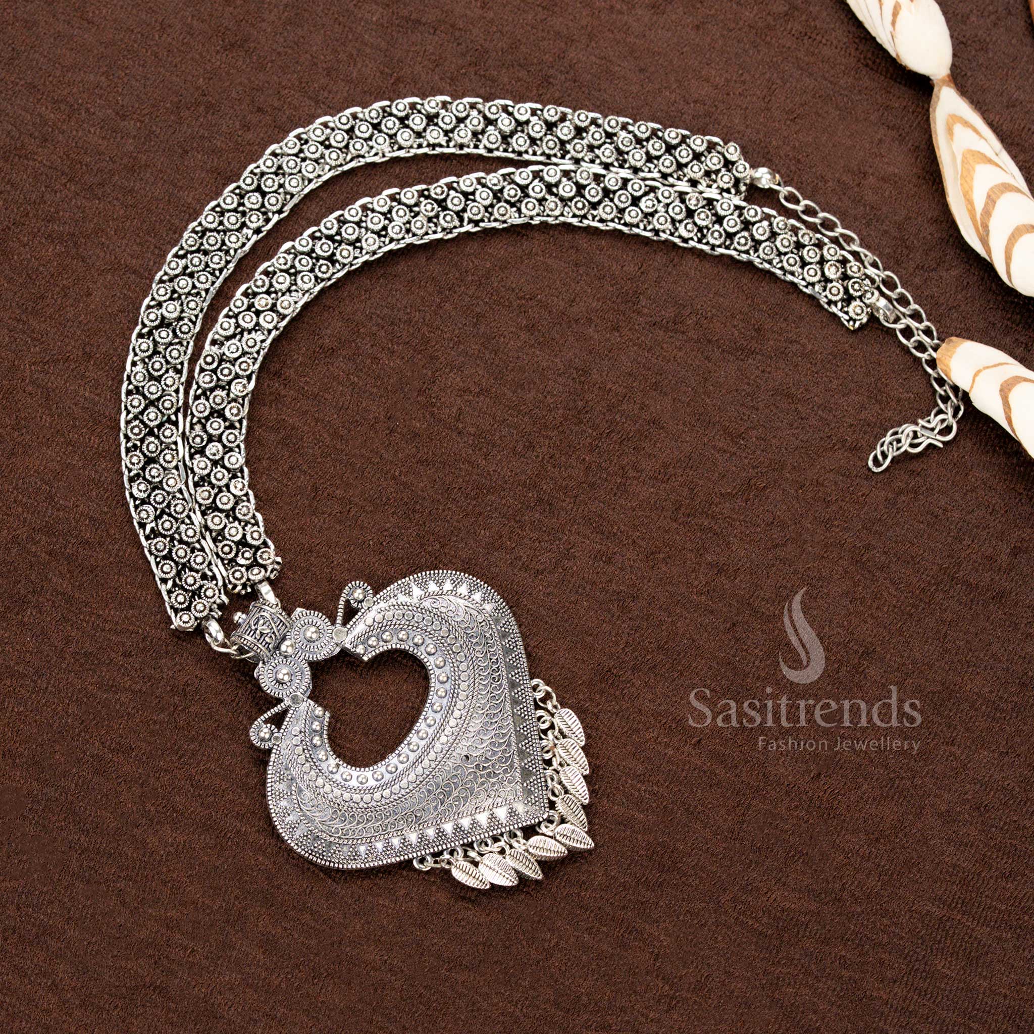 Oxidised tribal necklace with heart-shaped pendant, leaf danglers, and double floral chain – traditional Navaratri jewellery - Sasitrends
