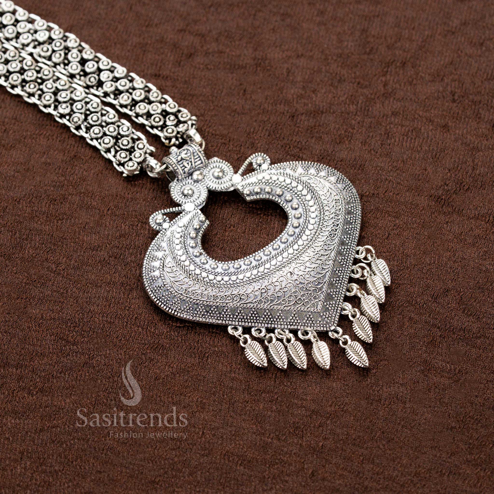 Oxidised tribal necklace with heart-shaped pendant, leaf danglers, and double floral chain – traditional Navaratri jewellery - Sasitrends