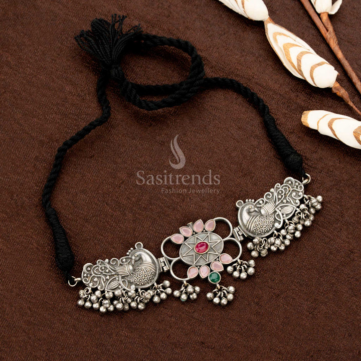 Oxidised dual-tone Navaratri necklace set adorned with rosy pink and rainbow-hued mirror stone teardrops, twin peacock motifs, and a bold floral design — a radiant piece of traditional jewellery for sarees and festive occasions - Sasitrends