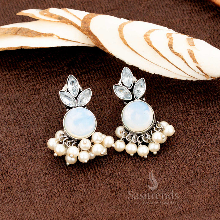 Oxidised silver earrings with ocean-blue Monalisa stone, floral AD setting, and pearl drops—traditional jewellery with a coastal royal vibe for weddings and temple wear - Sasitrends