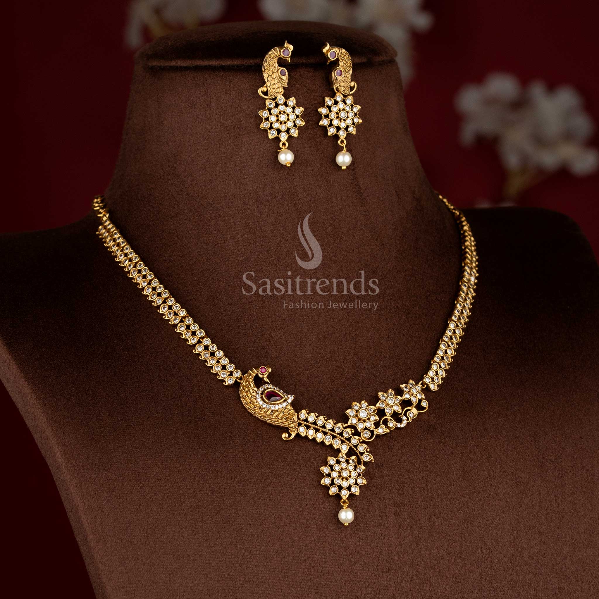 Regal American diamond matte gold plated white-ruby floral peacock necklace set with designer earrings for traditional celebrations – Sasitrends
