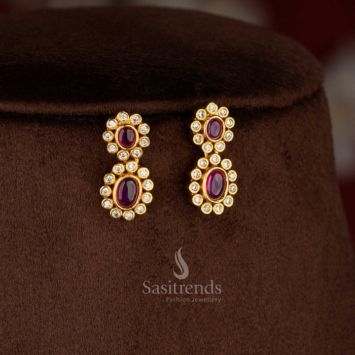 Charming matte gold plated ruby oval floral AD earrings for festive saree and celebration-ready outfits – Sasitrends