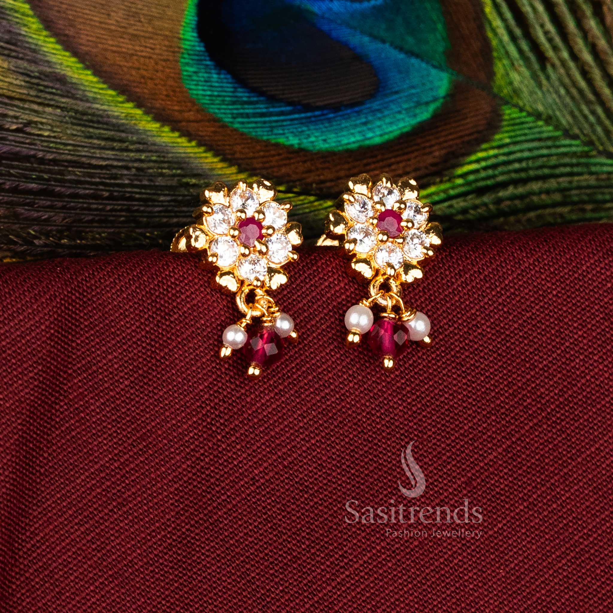 Majestic Micro Gold Plated AD Starburst Rosette Floral Drop Earrings in White-Ruby, Perfect for Traditional Occasion Jewellery – Sasitrends