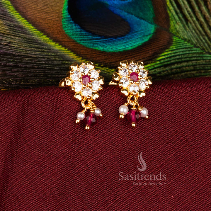 Majestic Micro Gold Plated AD Starburst Rosette Floral Drop Earrings in White-Ruby, Perfect for Traditional Occasion Jewellery – Sasitrends