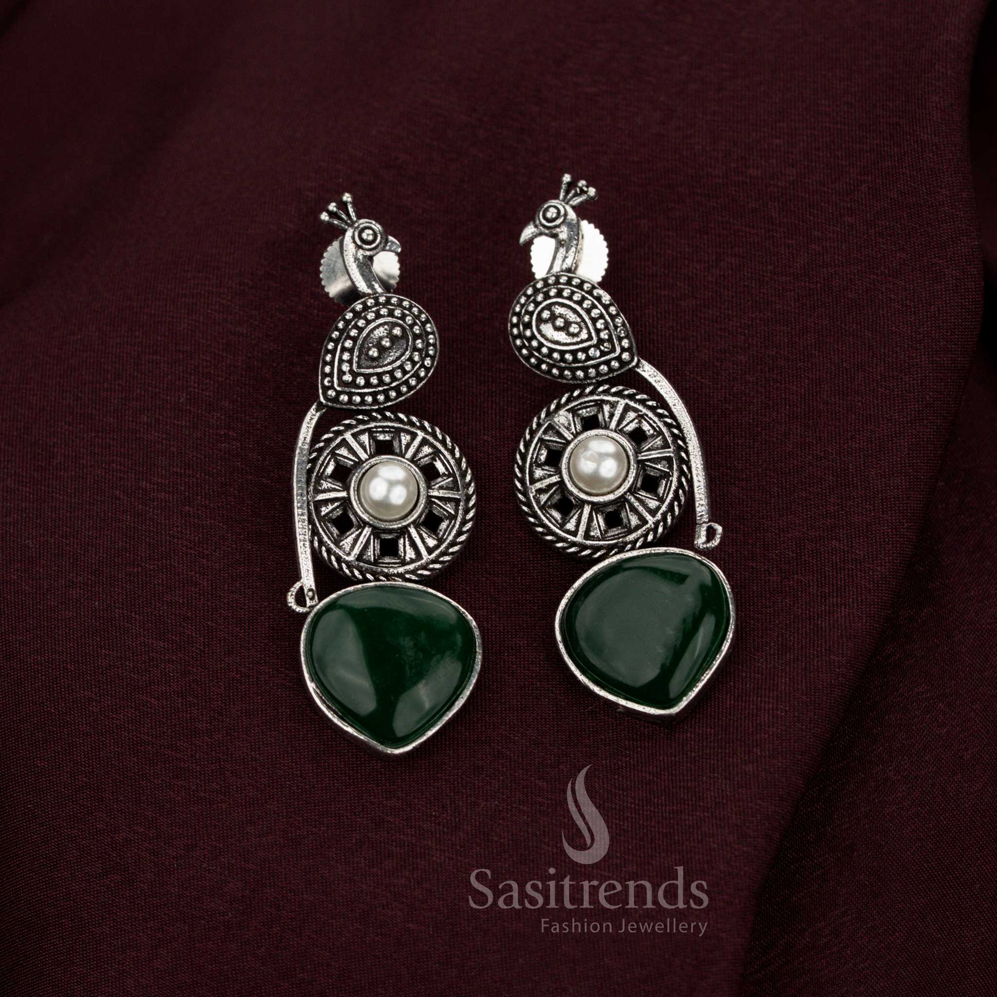 Heritage green oxidised peacock earrings created with radiant pearl embellishments baroque artistry and sovereign craftsmanship designed for illustrious Navarathri wear and jewellery grandeur – Sasitrends