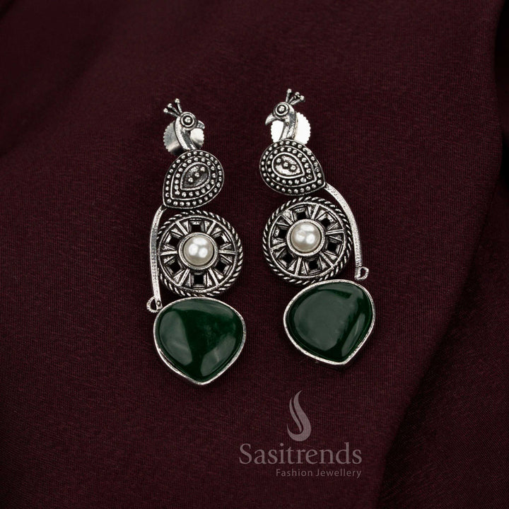Heritage green oxidised peacock earrings created with radiant pearl embellishments baroque artistry and sovereign craftsmanship designed for illustrious Navarathri wear and jewellery grandeur – Sasitrends