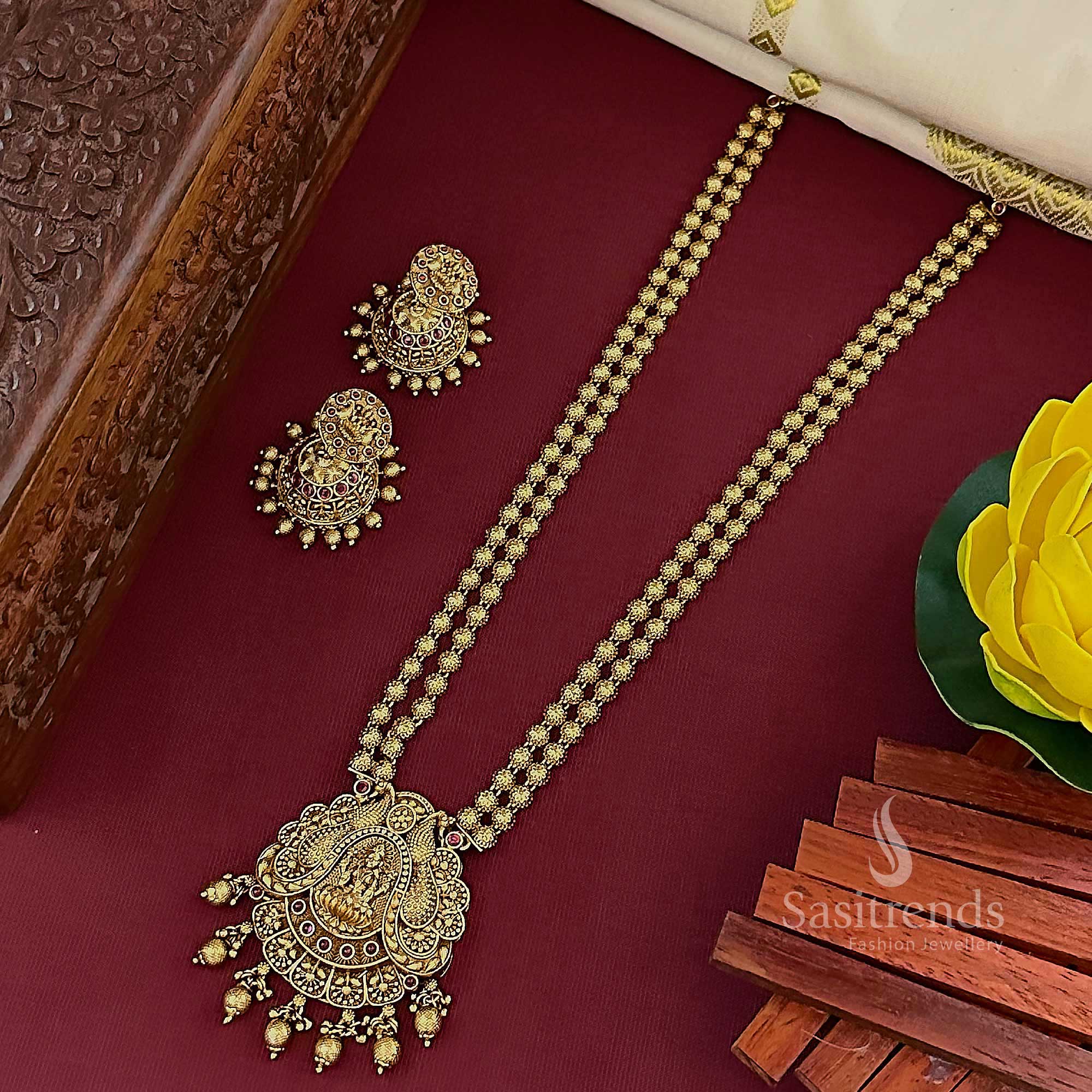 Graceful ruby temple matte gold plated traditional dual-layer long jewellery with Lakshmi pendant and classic jhumkas, designed for elegant bridal ensembles – Sasitrends