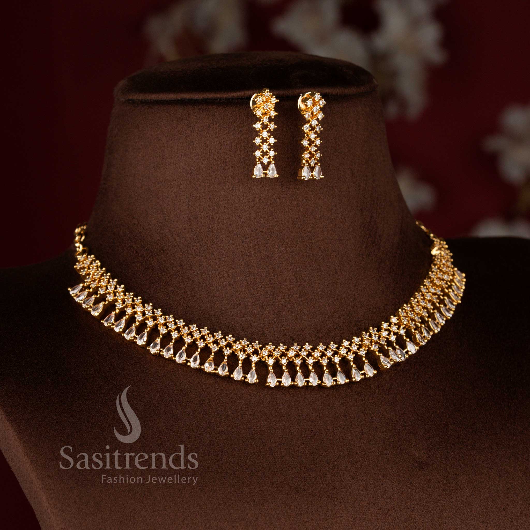 Graceful micro gold plated AD floral drop earrings in white coordinating with necklace design – Sasitrends