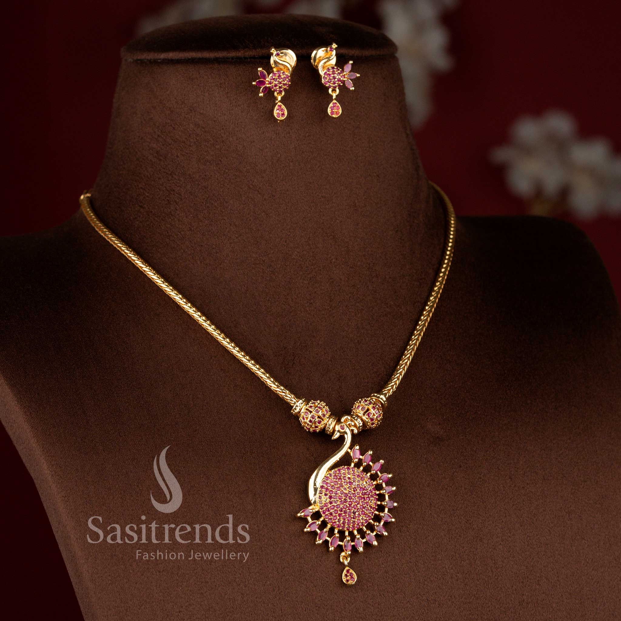 Majestic micro gold plated peacock necklace in deep ruby with intricate gemstone work and pearl highlights for bridal or festive ensembles – Sasitrends
