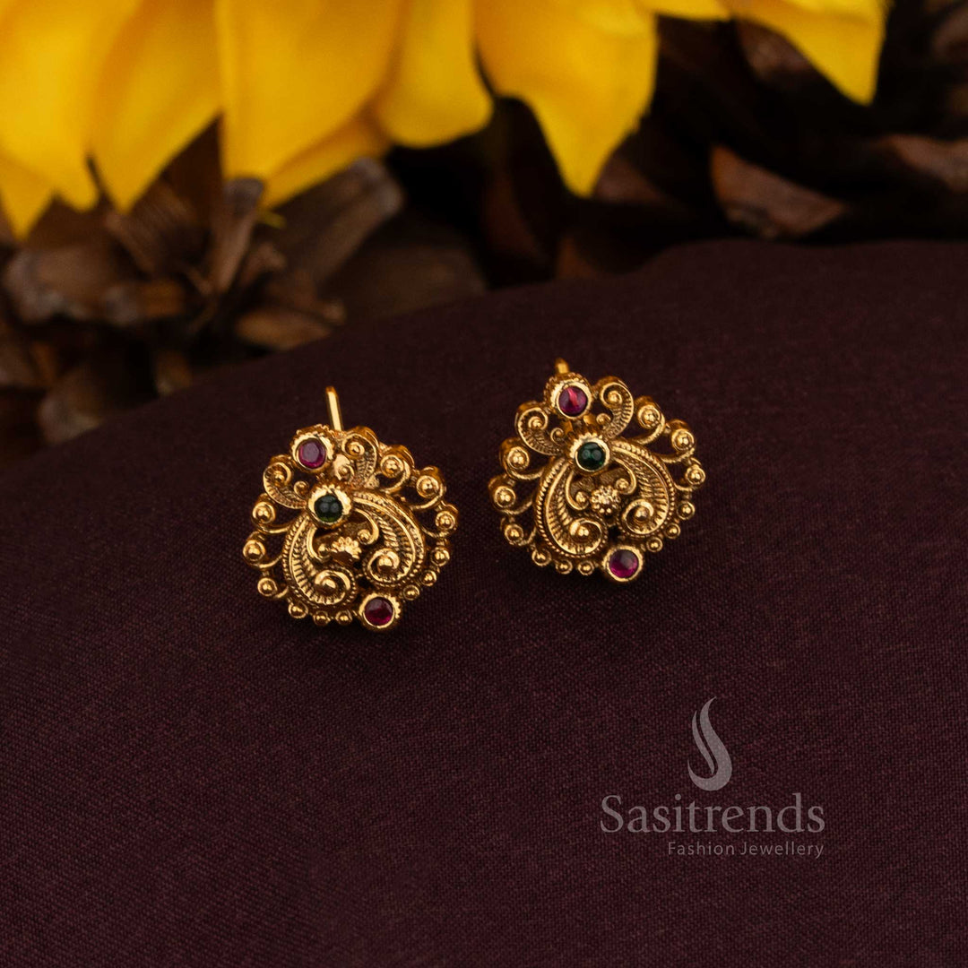 Illustrious ruby green AD floral earrings adorned with ornamental filigree artistry and matte gold grandeur ideal for cultural festivals heritage elegance and sovereign jewellery – Sasitrends
