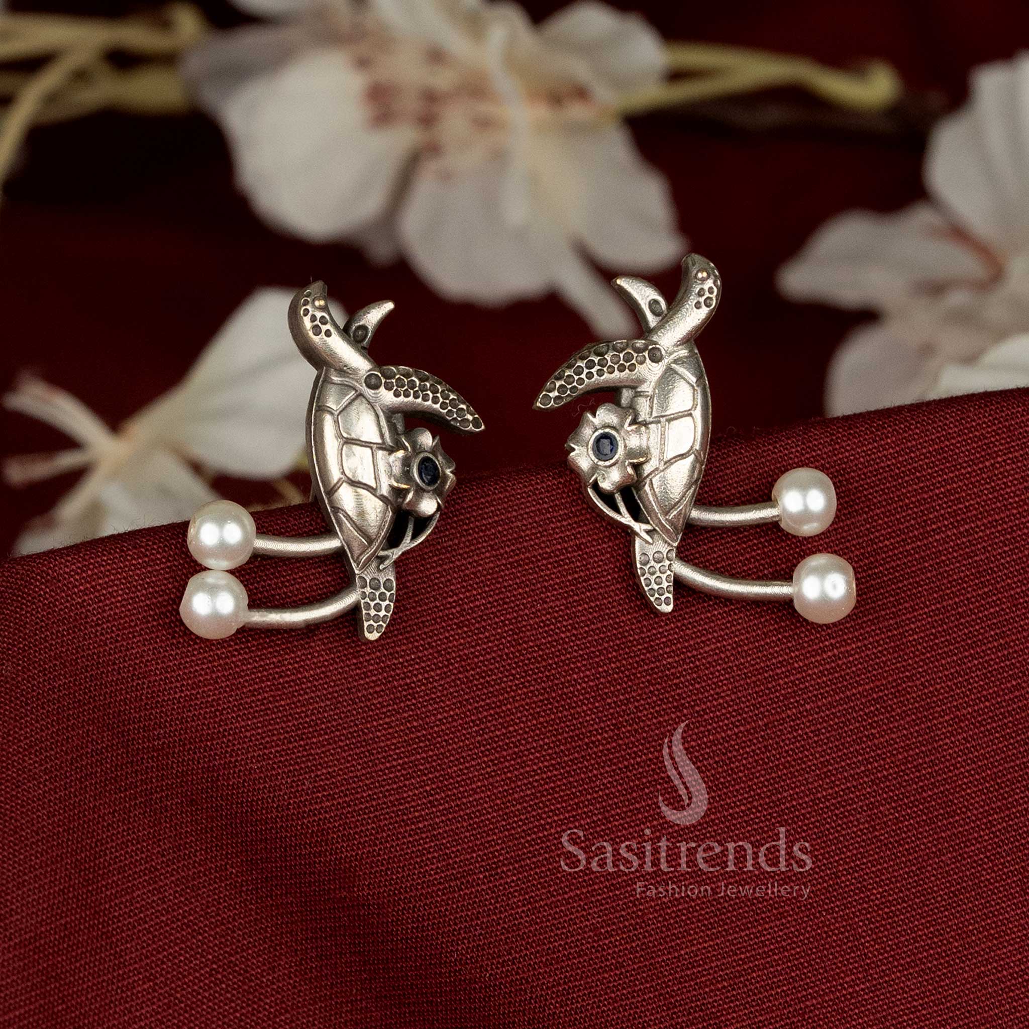 Elegant oxidised German silver walking turtle earrings adorned with white pearls and stone accents, ideal for casual, office, and ethnic wear – Sasitrends