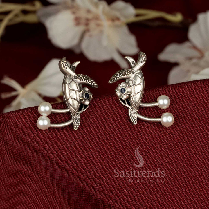Elegant oxidised German silver walking turtle earrings adorned with white pearls and stone accents, ideal for casual, office, and ethnic wear – Sasitrends