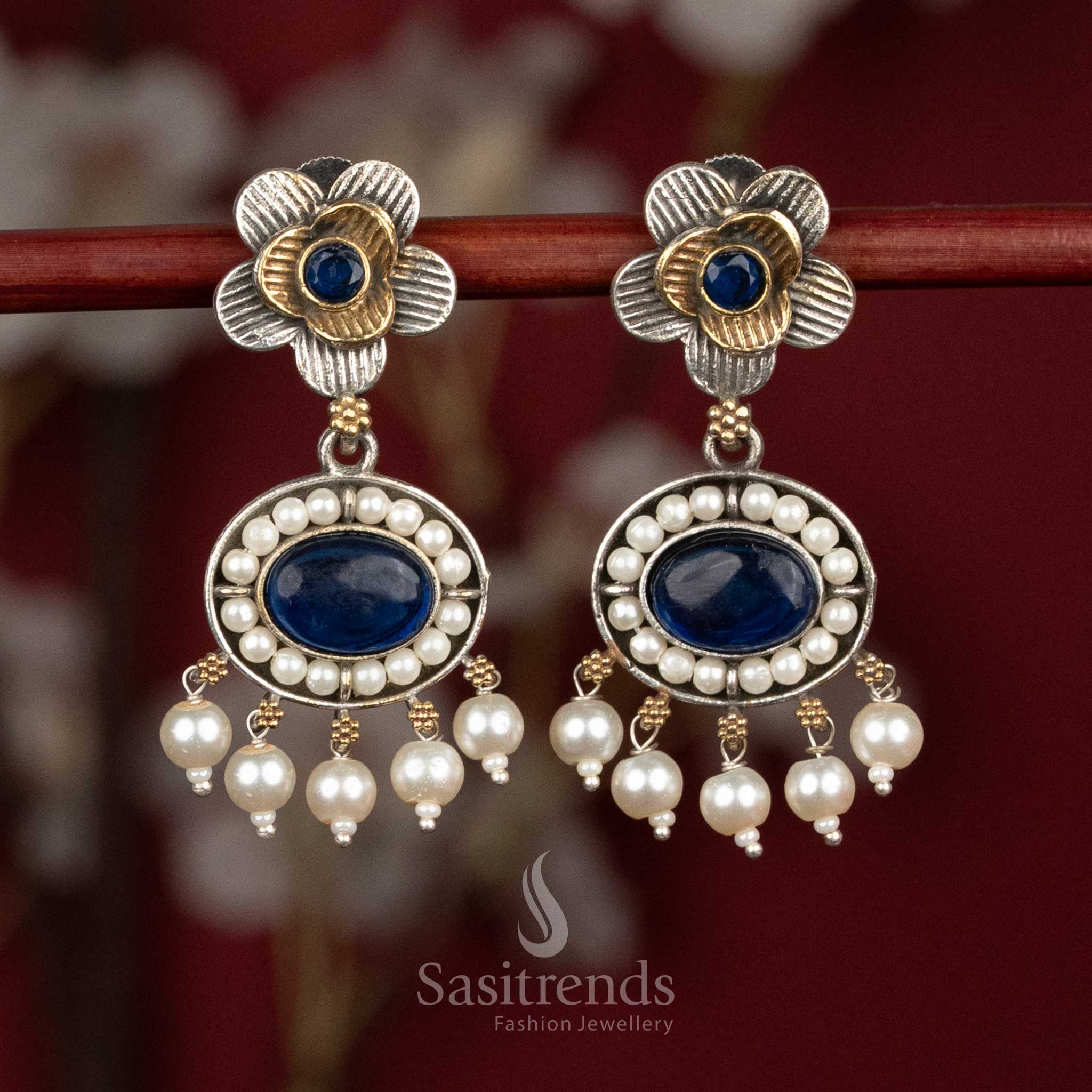 Vibrant oxidised silver floral stud earrings adorned with blue Monalisa stones and pearl accents for lively cultural styling - Sasitrends