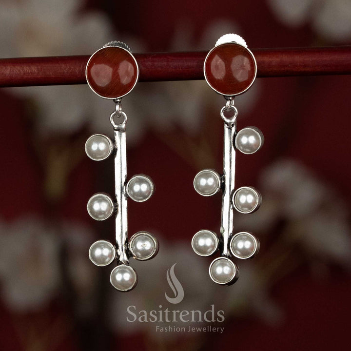 Gorgeous oxidised silver earrings with pearl and monalisa stones maroon colour for festive traditional wear - Sasitrends