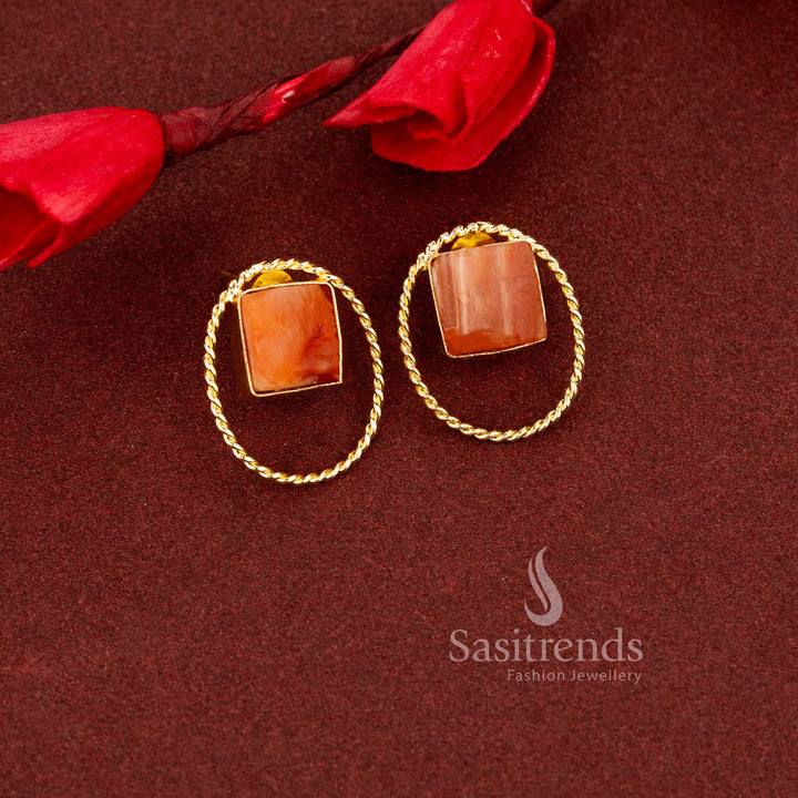 Muted oval natural peach stone stud earrings enhanced with classic rope textured gold plating ideal for refined office and daily ensembles - Sasitrends