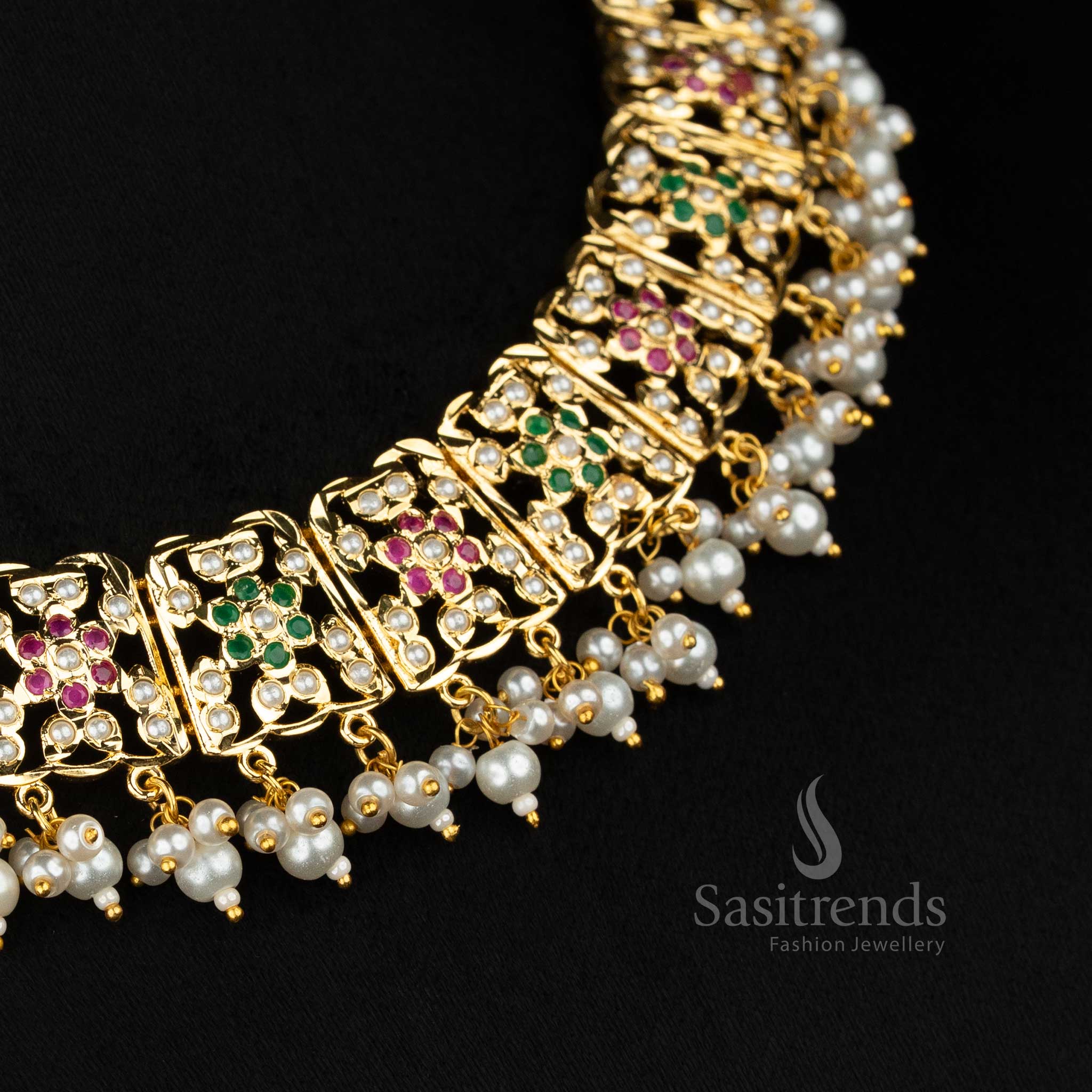 Pearl ruby green RoyalPetals Punjabi jadau gold plated flower pearl necklace set designed for traditional functions and joyful celebration wear - Sasitrends