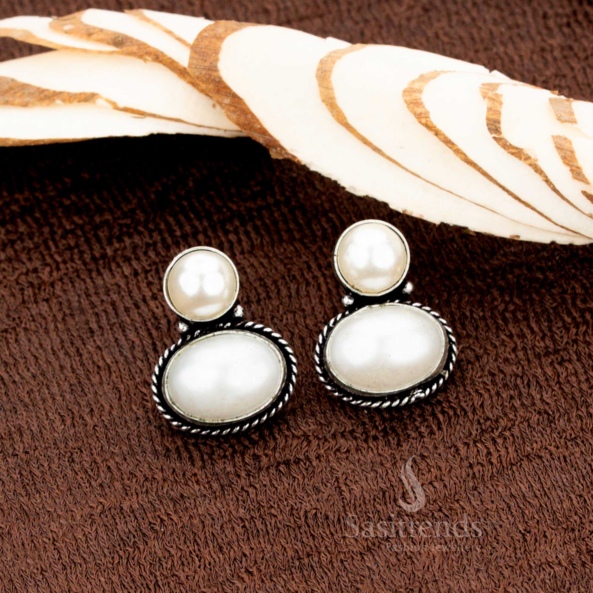 Oxidised German silver Pearl oval Monalisa stud earrings designed for women with a love for fusion fashion—a simple, minimalist jewellery design that complements both Indo-western and traditional outfits - Sasitrends