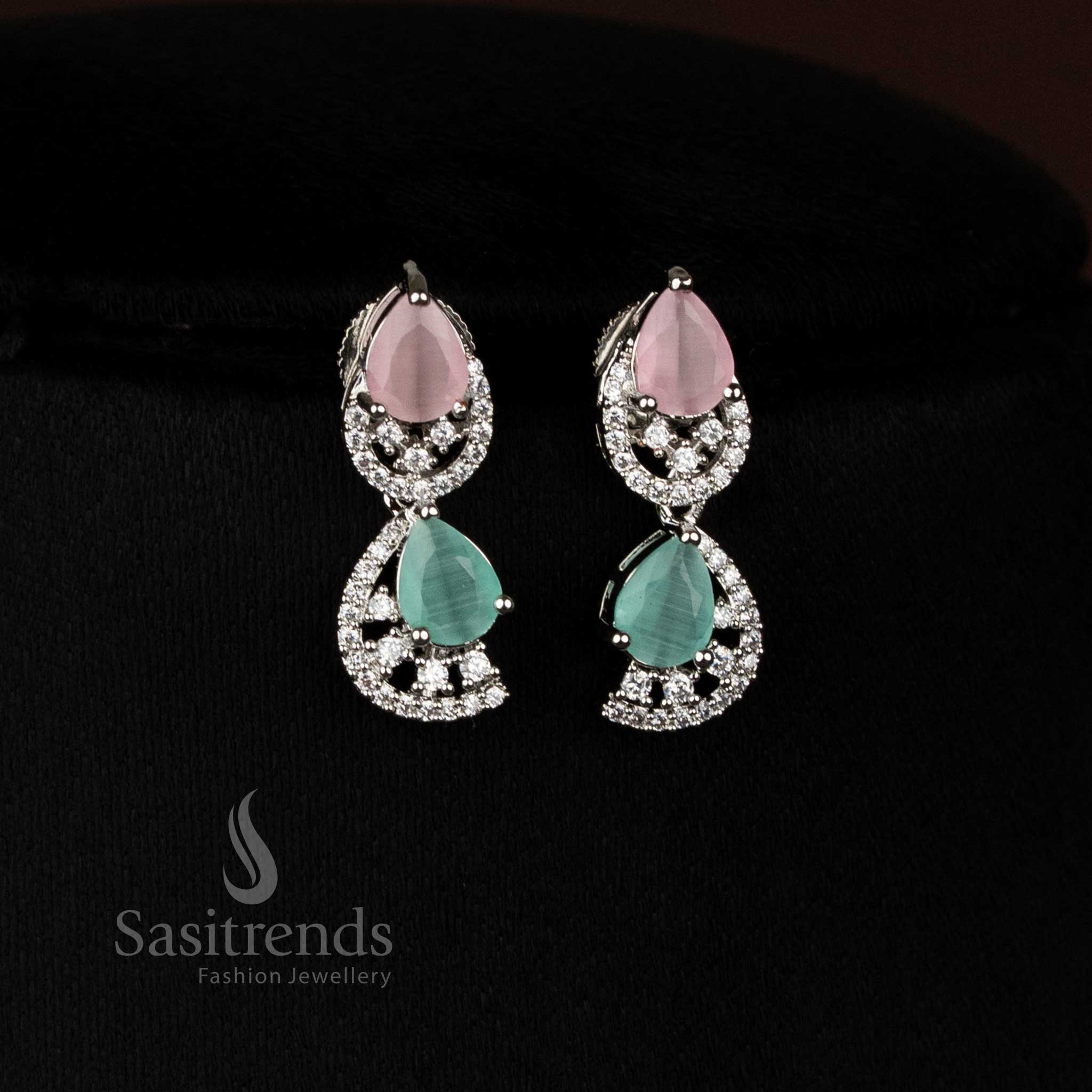 Graceful pink mint rhodium silver infinity teardrop earrings with sparkling American diamonds for party wear - Sasitrends