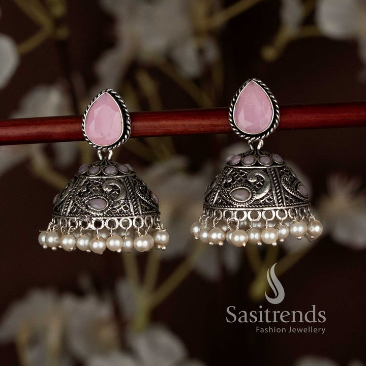 Stylish pink oxidised peacock motif teardrop stud jhumka earrings with pearl drops, perfect for ethnic party look and graceful Navaratri festive wear by Sasitrends