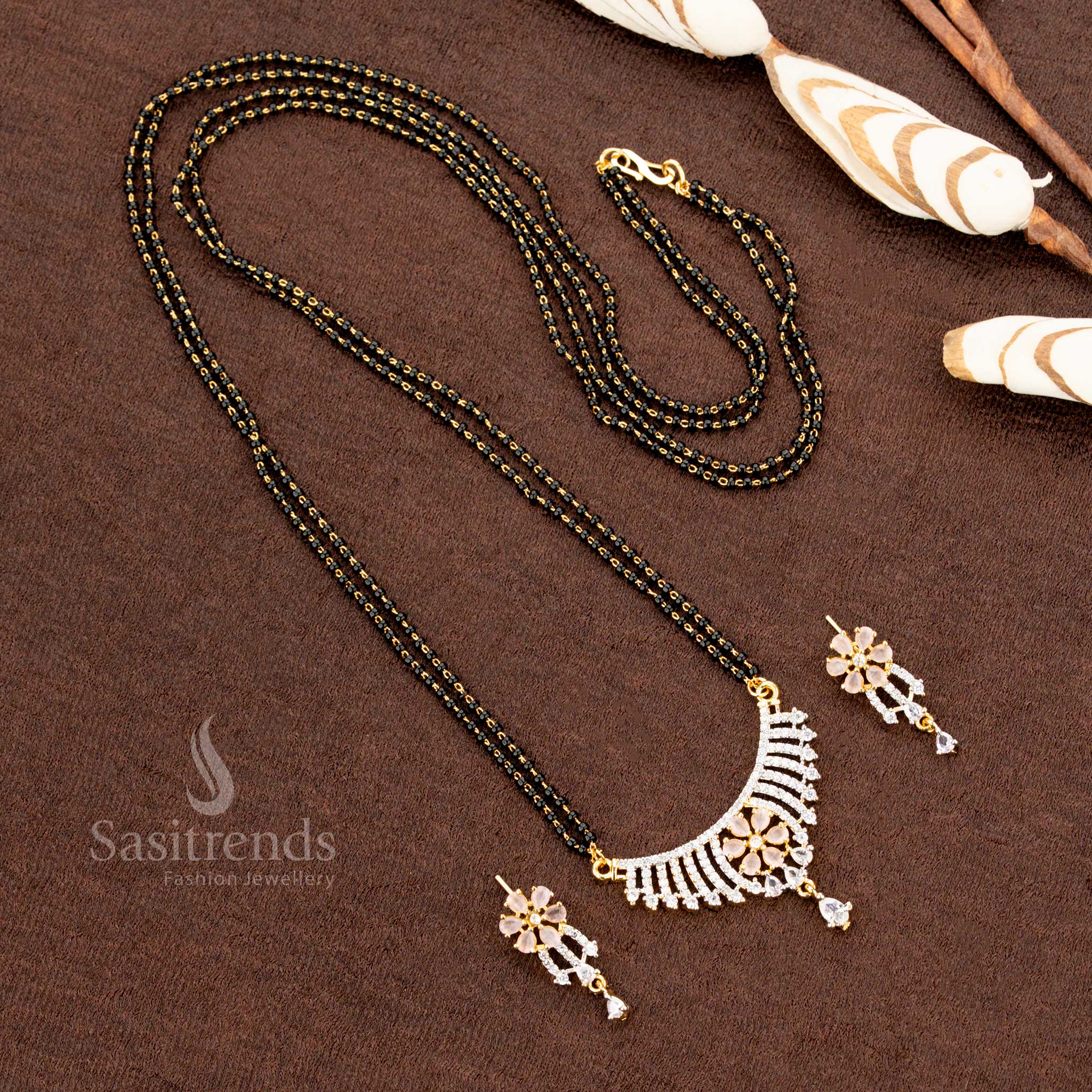 Exquisite pink American Diamond pendant set with a floral design, paired with a micro gold plated Mangalsutra chain and matching earrings, perfect for traditional jewellery lovers - Sasitrends