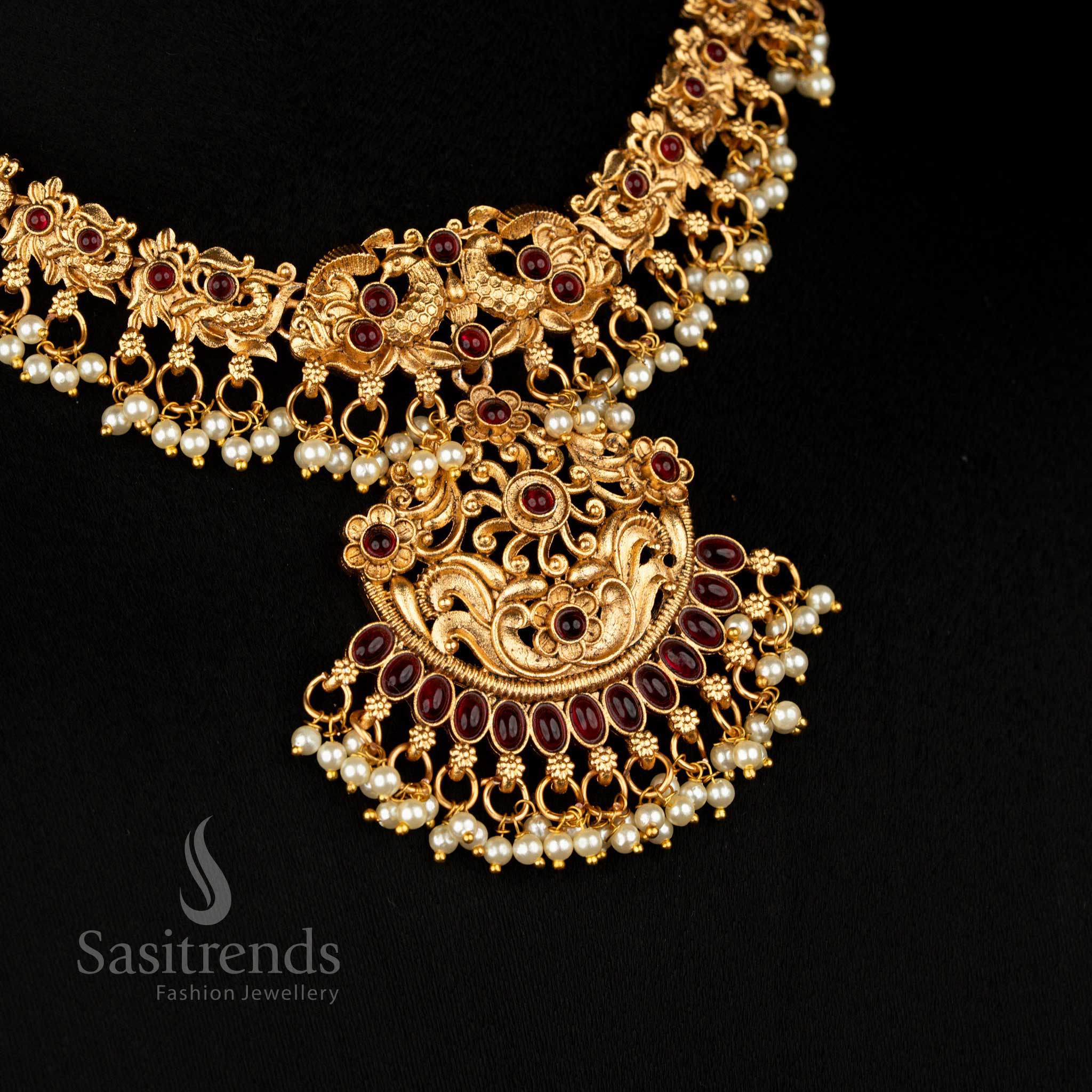 Peacock Matte Gold Plated Necklace Jewellery Set with Delicate Floral Motifs and Matching Jhumkas in Radiant Ruby, Exquisite Choice for Bridal Wear – Sasitrends