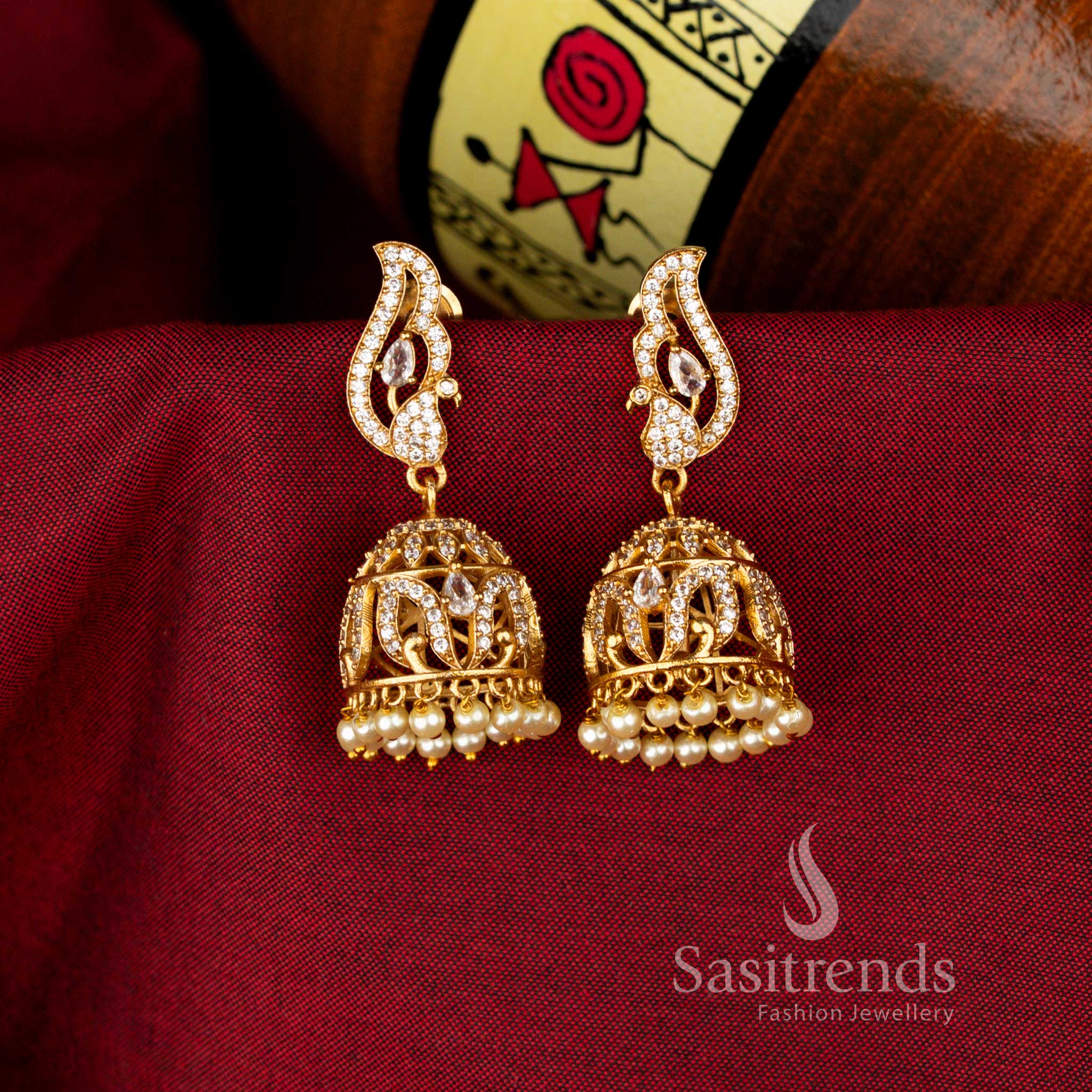 Radiant White Peacock Temple Matte Gold Jhumka Earrings Designed with Traditional Craftsmanship for Elegant Designer Jewellery Appeal – Sasitrends