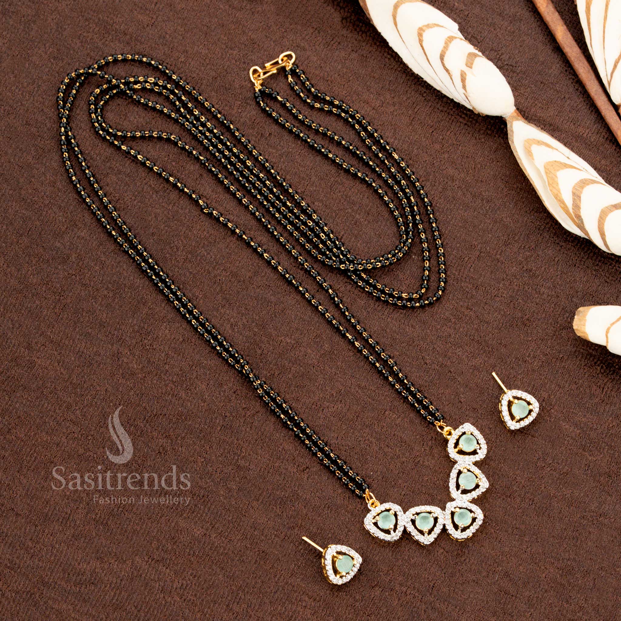 Stunning mint AD pendant set featuring a tri-petal drop design, Mangalsutra chain, and matching earrings, micro gold plated for a premium festive jewellery collection - Sasitrends