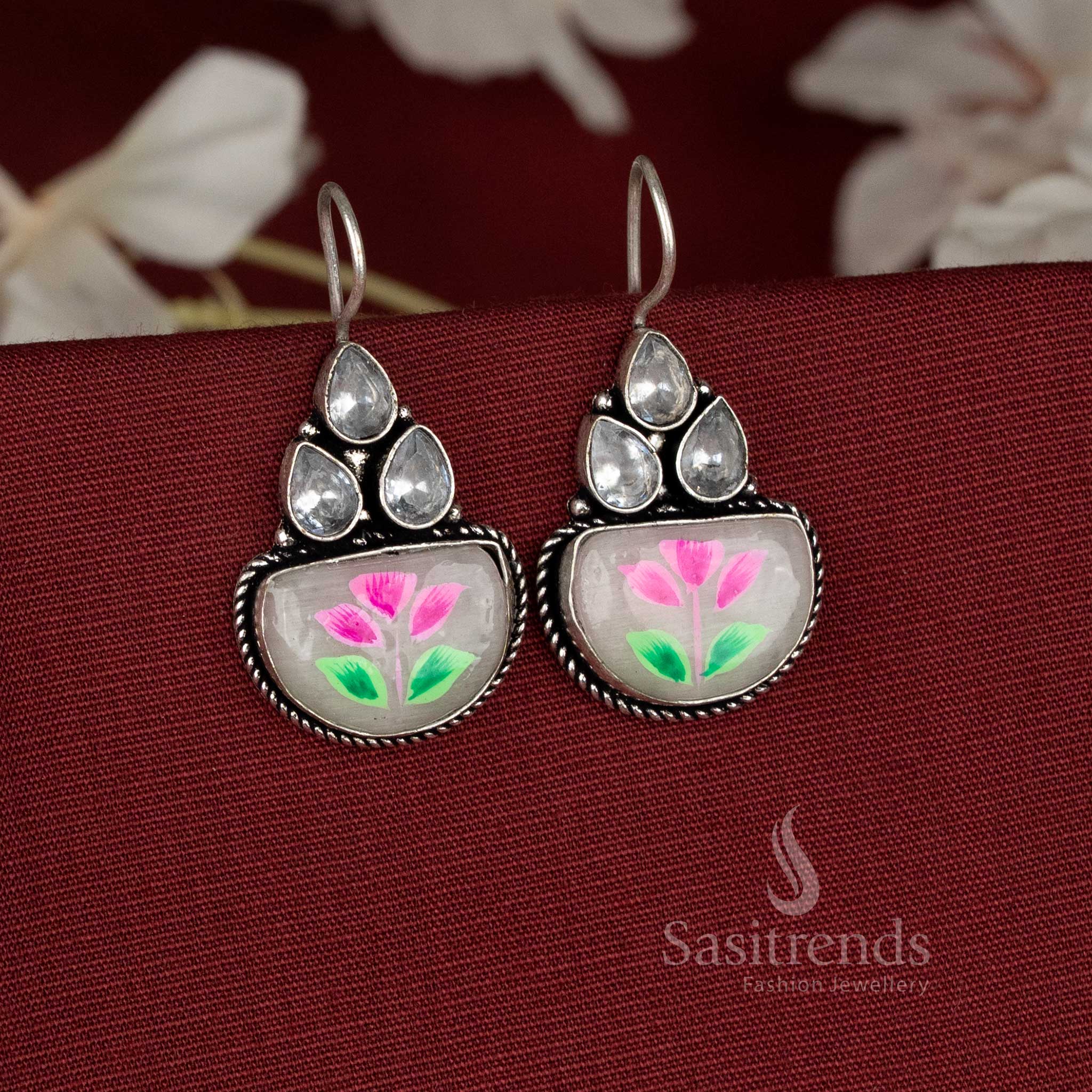 Pearlshine oxidised earrings accented with white Monalisa stones and delicate hand-painted floral artwork – Sasitrends