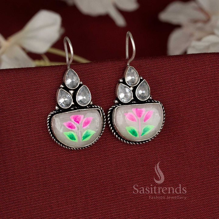 Pearlshine oxidised earrings accented with white Monalisa stones and delicate hand-painted floral artwork – Sasitrends