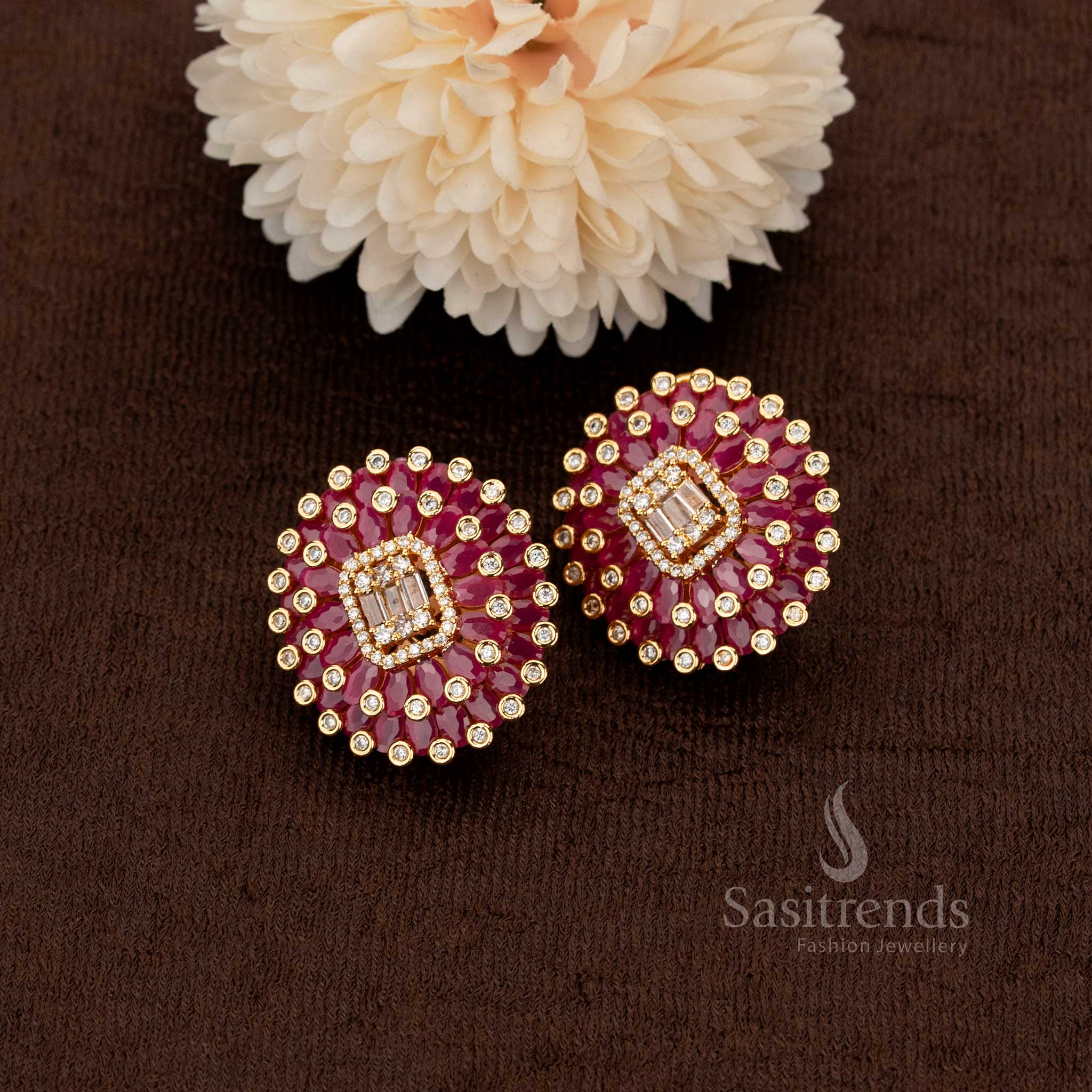Opulent floral stud earrings in rich ruby tones with shimmering American diamond accents designed to complement bridal and ethnic outfits – Sasitrends