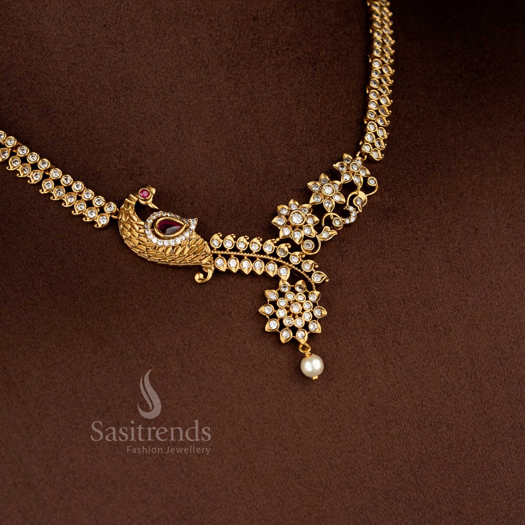 Elegant American diamond matte gold plated white-ruby floral peacock necklace for sarees and festive occasions – Sasitrends