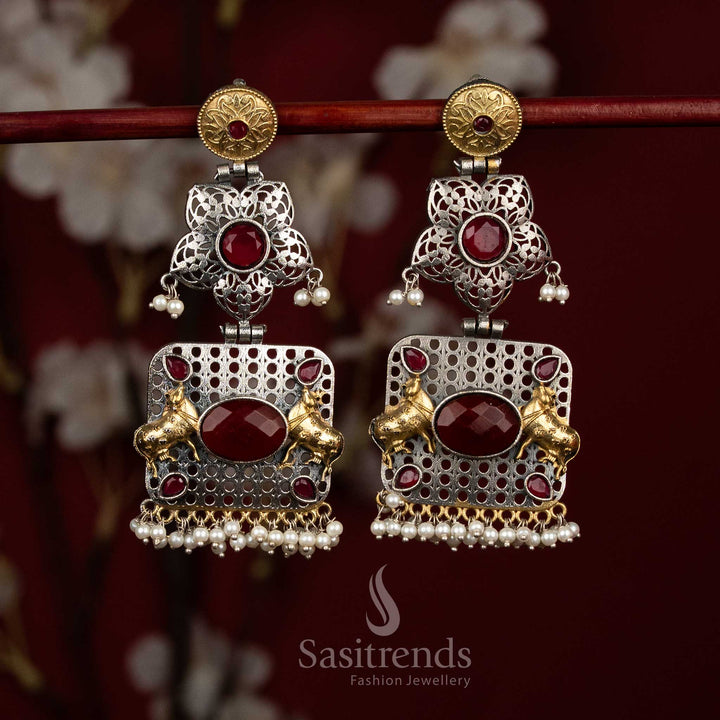Opulent antique oxidised 92.5 silver ruby floral mandala Nandi bull panel earrings with oval Monalisa stones and linear pearl fringes for festive - jewellery - Sasitrends