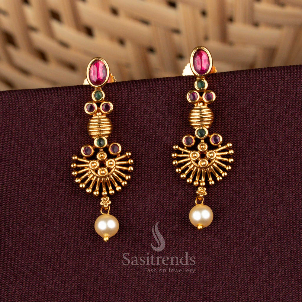 Seraphic ruby green temple earrings styled with opulent matte gold artistry, majestic sunburst carvings, illustrious AD embellishments, and splendid pearl drops for bridal grandeur – Sasitrends