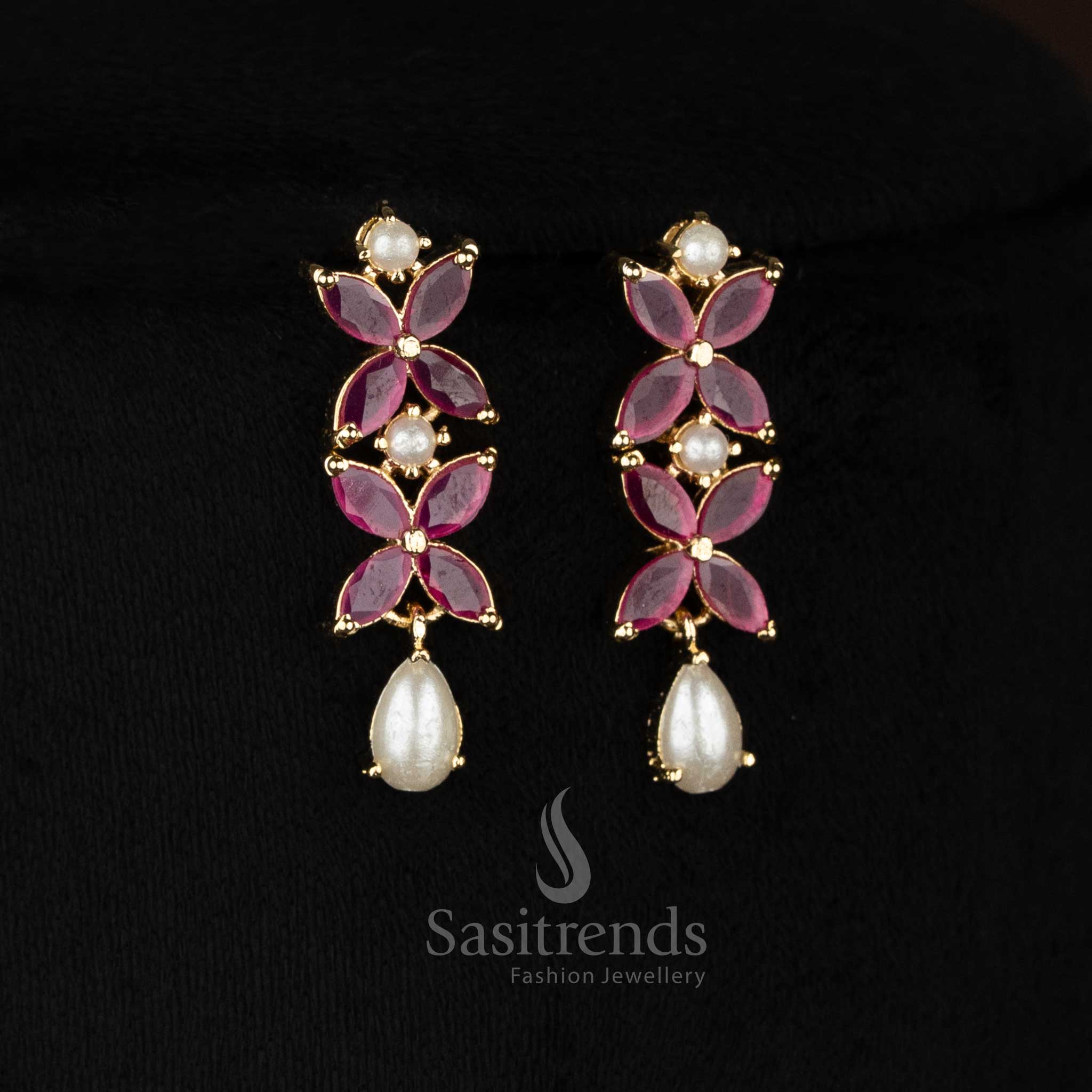 Graceful micro gold plated white four petal AD floral earrings with pearls ideal for evening parties and festive celebrations -Sasitrends
