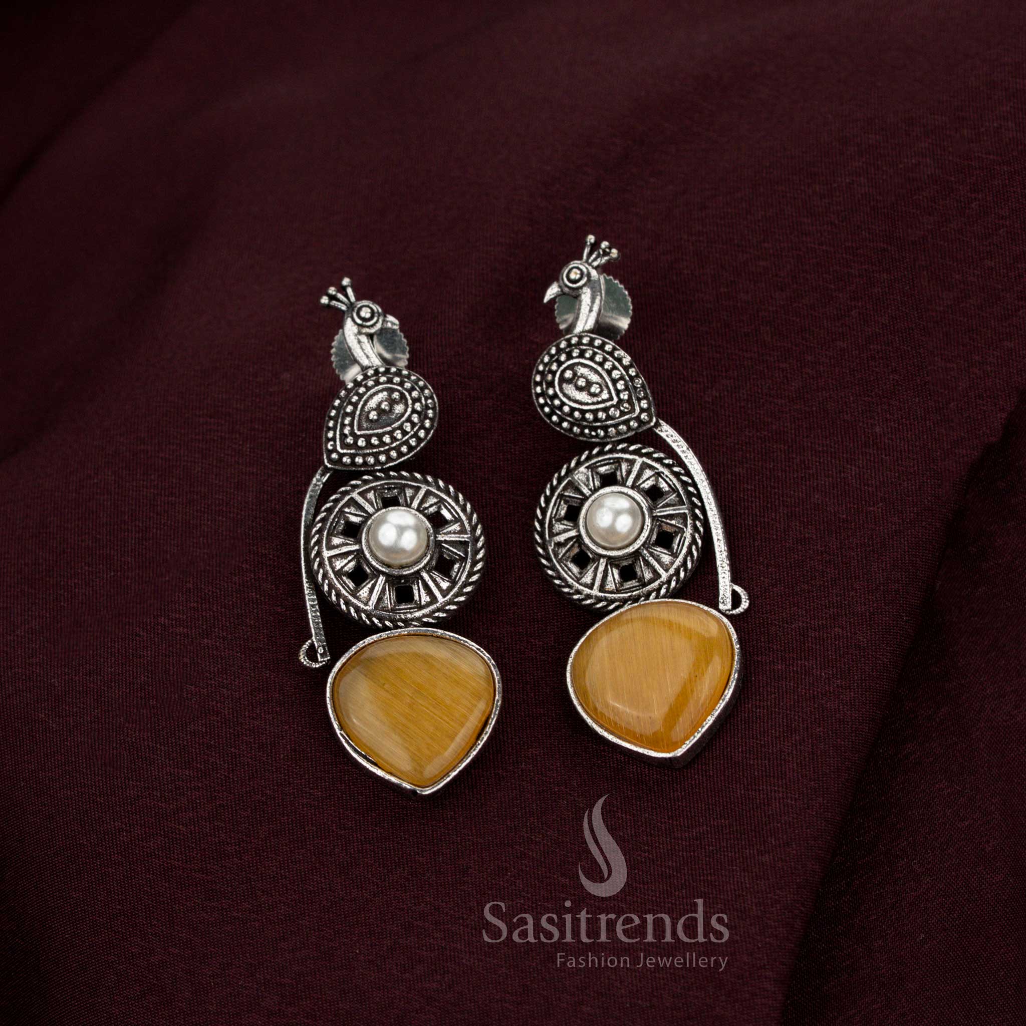 Lavish yellow oxidised peacock earrings designed with resplendent pearl detailing crafted for sacred heritage occasions aristocratic elegance and splendid jewellery artistry – Sasitrends