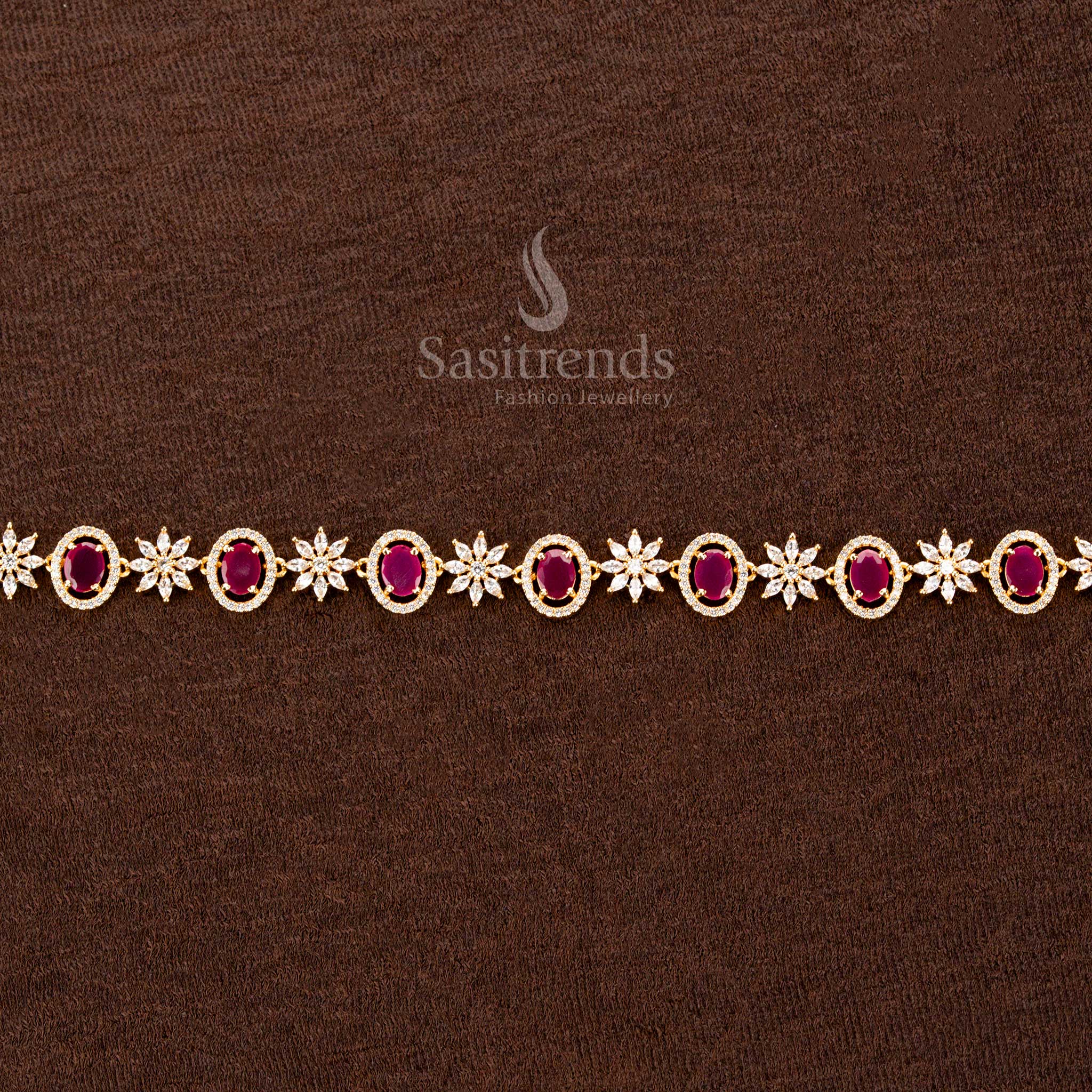 Dazzling ruby American diamond gold-plated hip belt with a striking oval stone, intricate floral motifs, and a brilliant finish—perfect for sarees and festive celebrations - Sasitrends