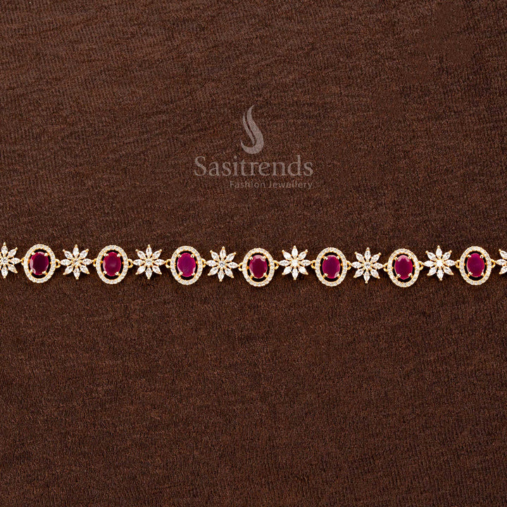 Dazzling ruby American diamond gold-plated hip belt with a striking oval stone, intricate floral motifs, and a brilliant finish—perfect for sarees and festive celebrations - Sasitrends