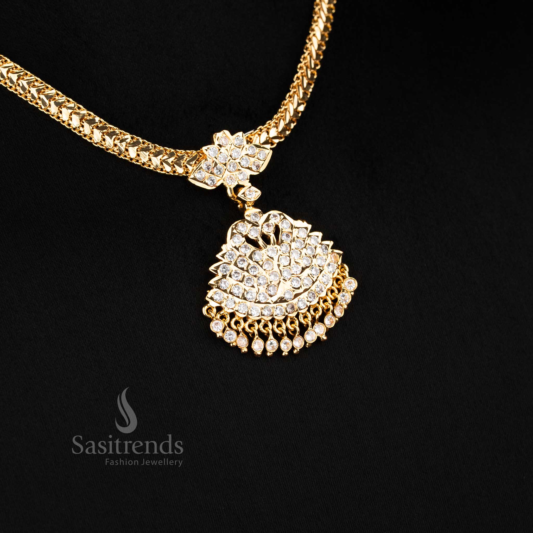 Graceful white micro gold peacock motif attigai necklace highlighted with shimmering diamond-like pendant detail, elegant ornament suited for traditional celebrations and wedding attire - Sasitrends