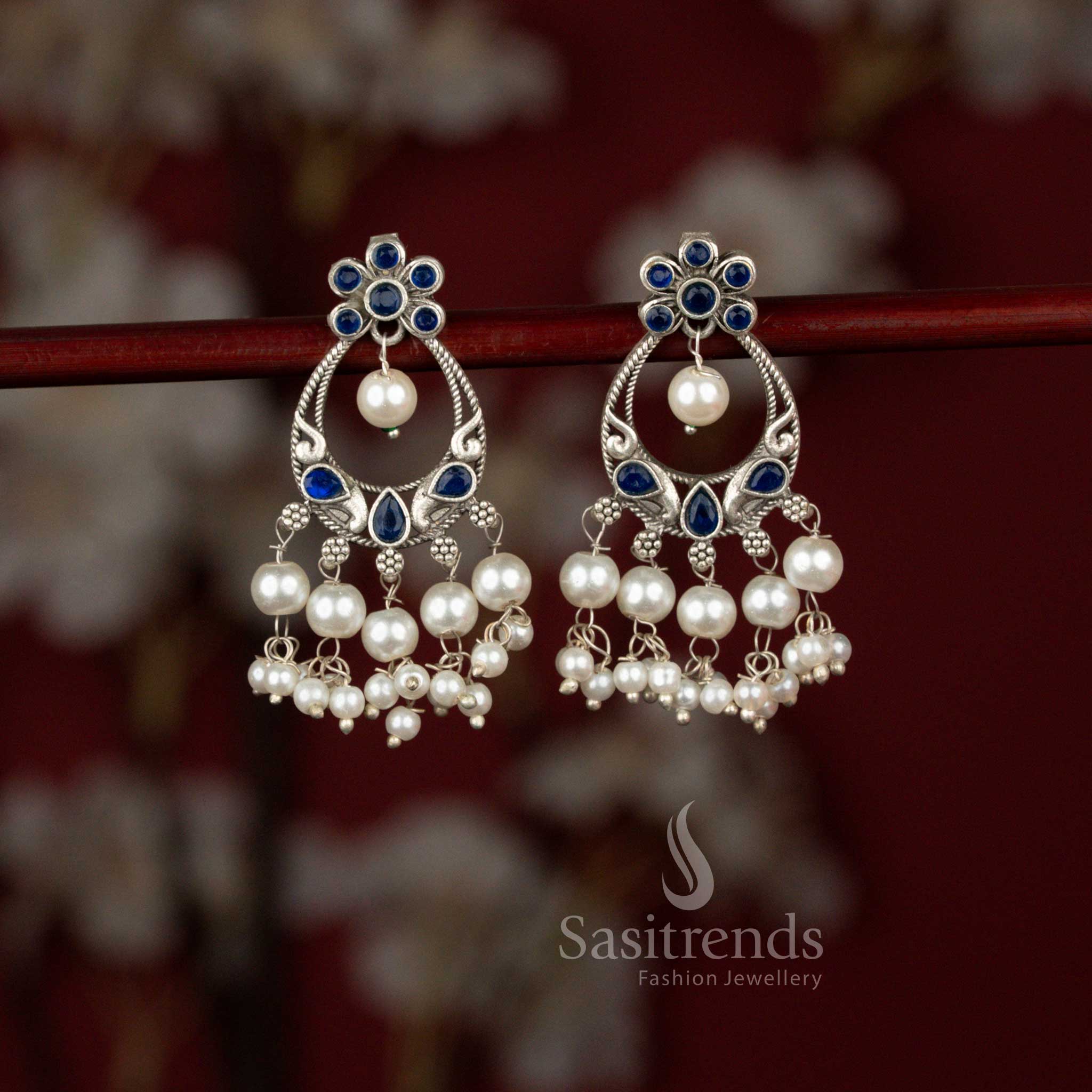 Graceful oxidised peacock chandbali earrings highlighted with blue tones and pearl drops ideal for festive ethnic styling – Sasitrends