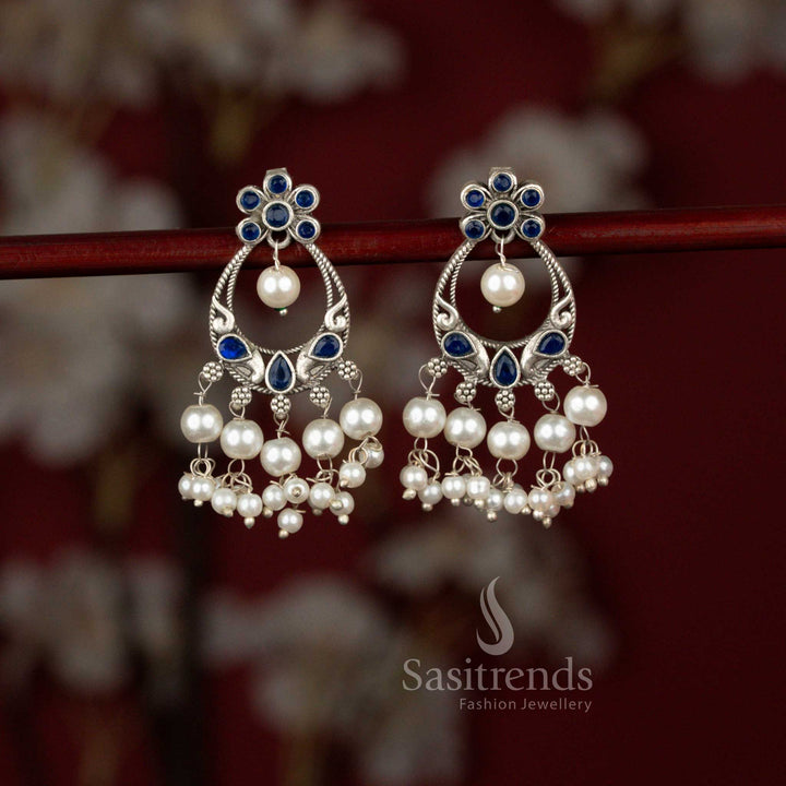 Graceful oxidised peacock chandbali earrings highlighted with blue tones and pearl drops ideal for festive ethnic styling – Sasitrends