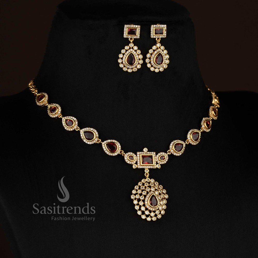 Radiant red American Diamond teardrop rectangle motif matte gold plated necklace perfect for stylish celebrations - Sasitrends
