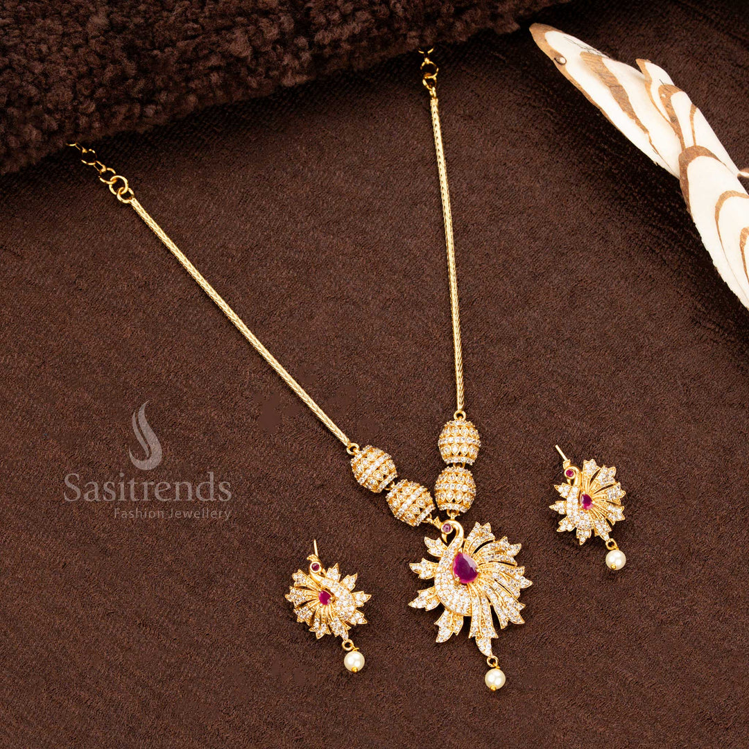 Exquisite traditional matte gold plated jewellery set featuring a grand peacock pendant adorned with dazzling ruby stones, intricately crafted for weddings, festive occasions, and cultural celebrations - Sasitrends