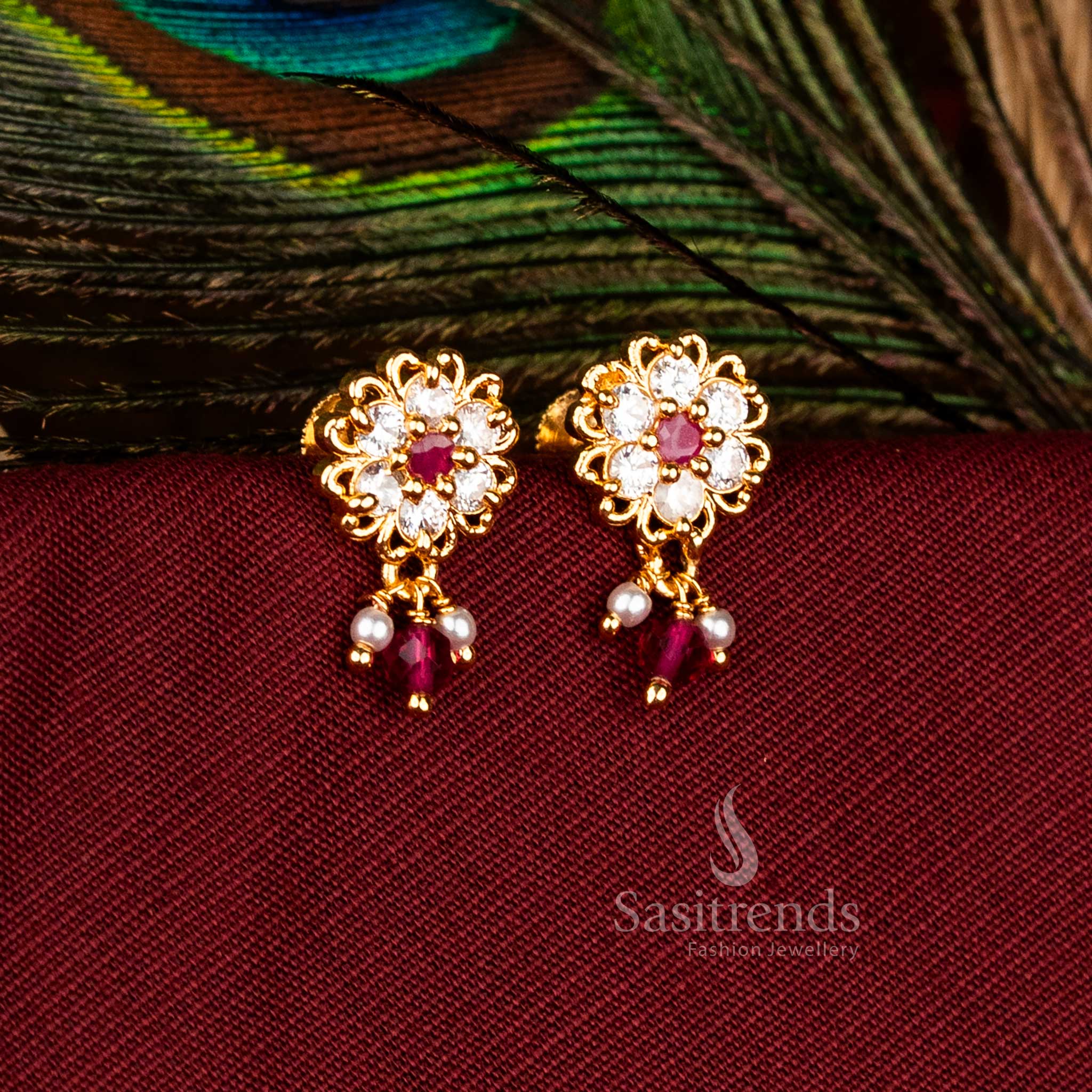 Ethereal Micro Gold Plated AD Lotus Outline Floral Drop Earrings in White-Ruby, Exceptional for Party and Festive Jewellery – Sasitrends