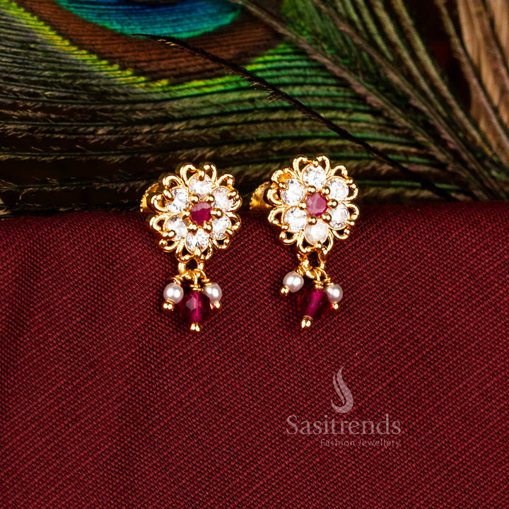 Ethereal Micro Gold Plated AD Lotus Outline Floral Drop Earrings in White-Ruby, Exceptional for Party and Festive Jewellery – Sasitrends