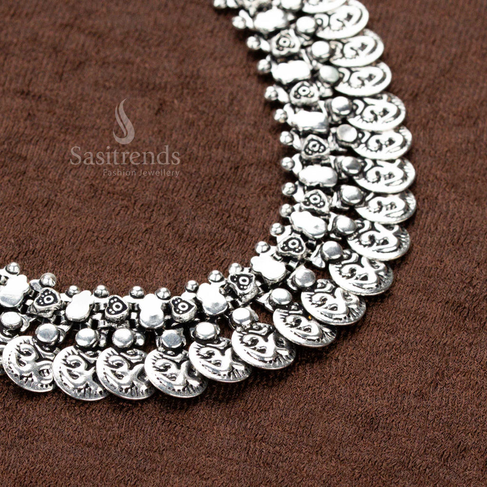 oxidised German silver choker necklace featuring intricately carved coin motifs and delicate floral accents, an exquisite piece for Navaratri styling, sarees, and ethnic grandeur - Sasitrends