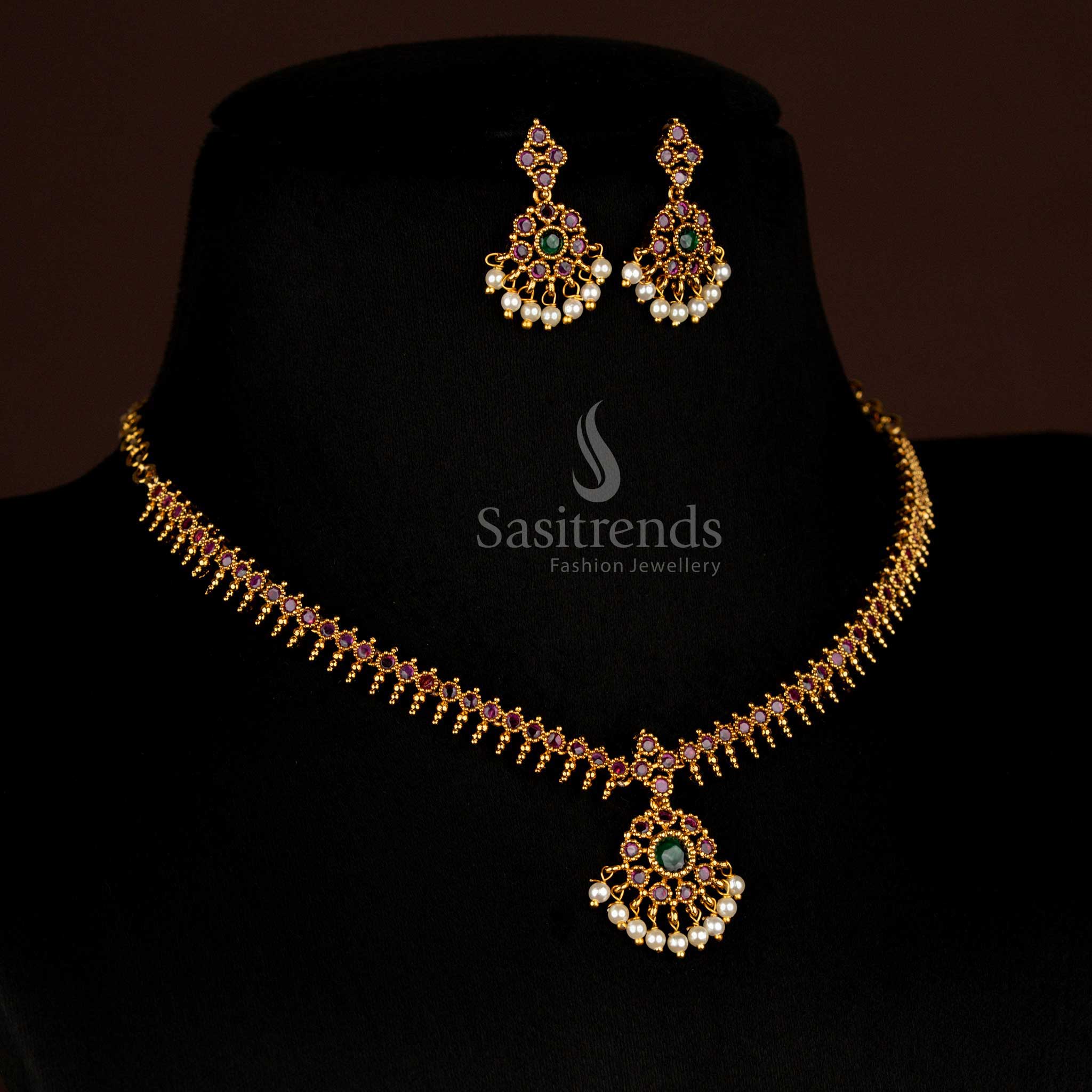 Temple matte gold AD stone necklace adorned with dual-tone ruby and green gemstones in circular floral design, ideal for festive and bridal wear – Sasitrends
