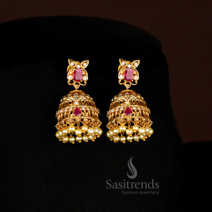Divine Temple Matte Gold White-Ruby Floral Jhumka Earrings With AD Stones And Pearls Designed For Grand Bridal Occasions - Sasitrends